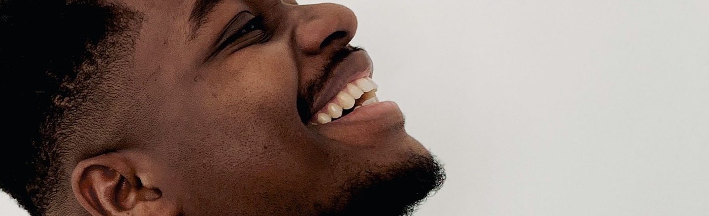 man laughing joyfully